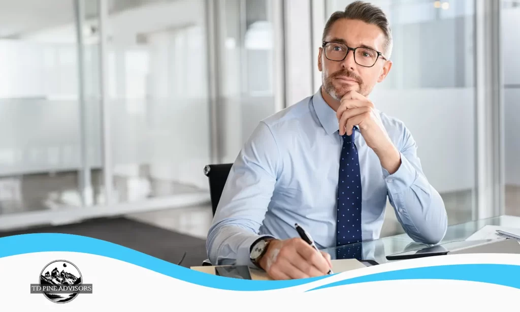 Business owner reviewing financial documents and considering hiring a CFO